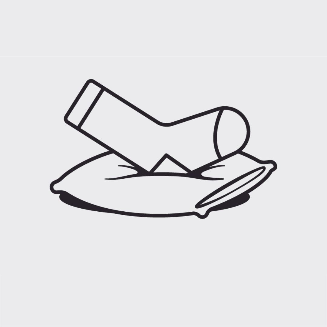 A sock resting on a pillow, symbolizing cushion