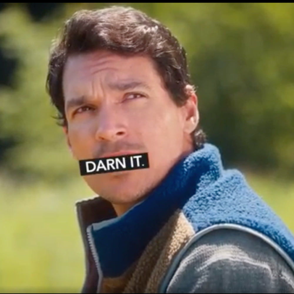 A man looking upset with "Darn It" censoring his mouth