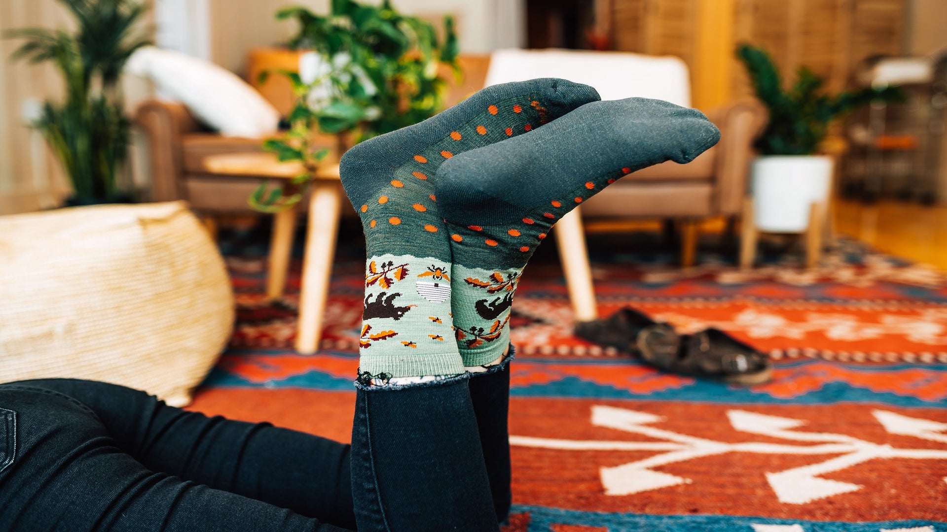 Model feet in the air wearing the wildlife crew in forest