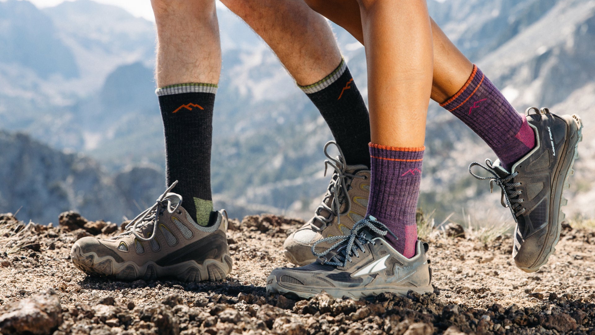 Close up on model  featureing the 1403 Men's hiker Boot sock and the Women's 1903 Micro crew hiker