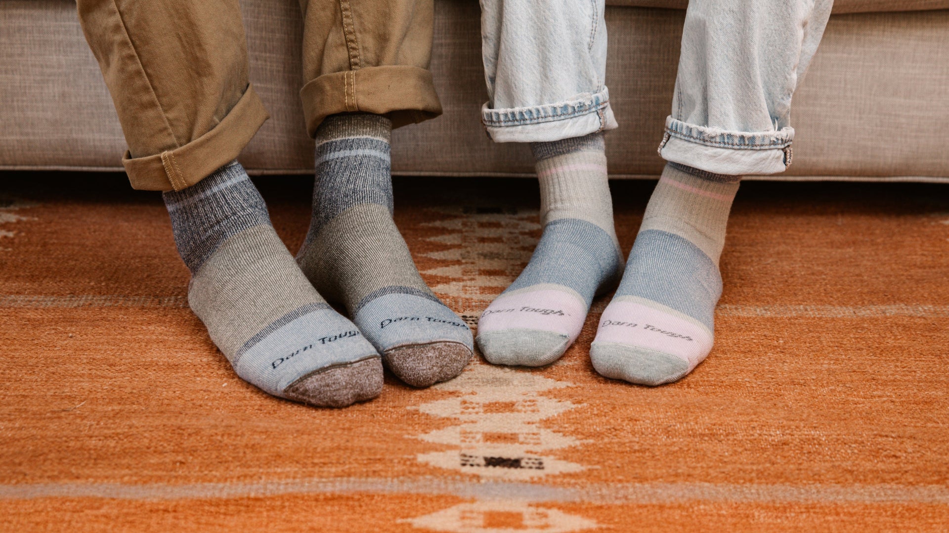 two models with feet on wood foor wearing new shorty heavyweight lifestyle