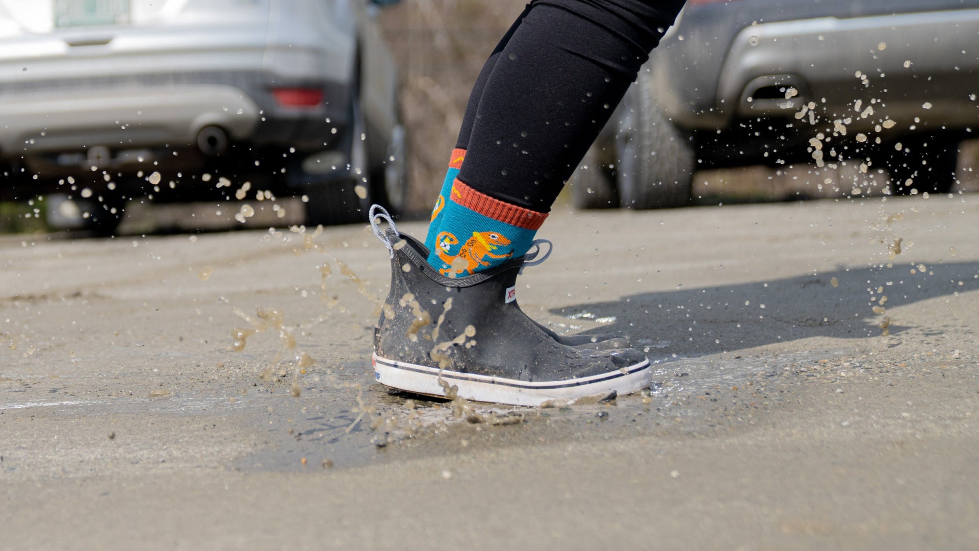 models feet jumping in puddle wearing low boots and kids sal micro crew