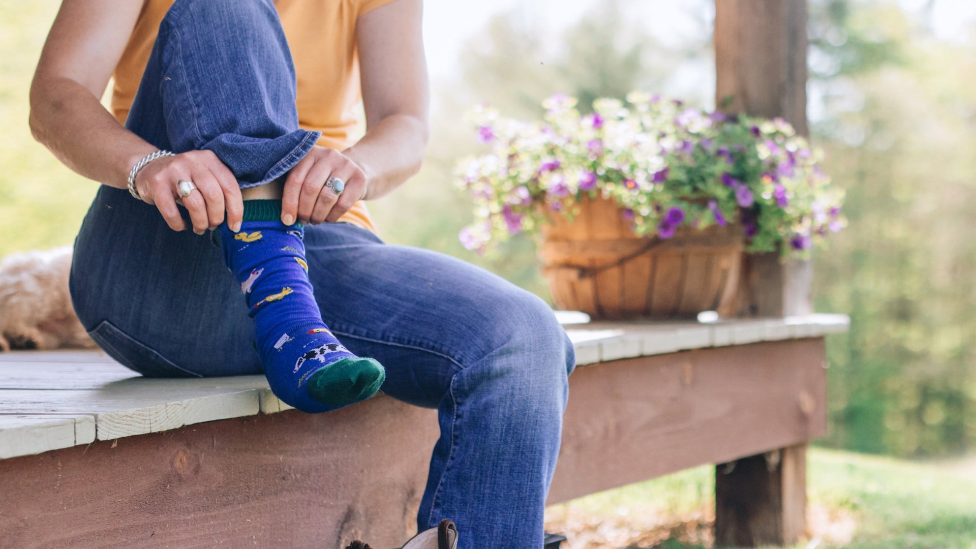 Close up on model featuring our Barnyard Lightweight lifestyle Knit to give sock 