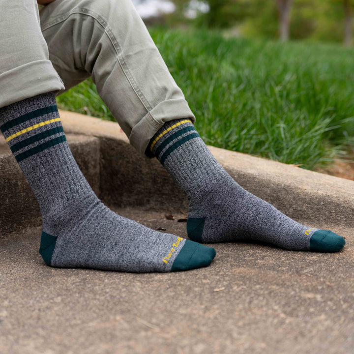 on model image of feet on the ground wearing the 6069 letterman crew in Pepper