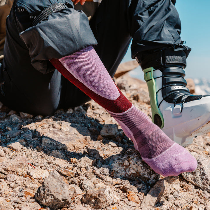 close up on model image of 8038 Burgundy back foot wearing ski boot