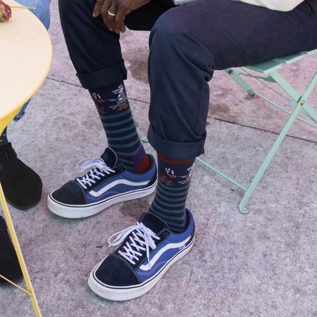 Close up of models feet sitting in chair wearing the 6096 Blackberry