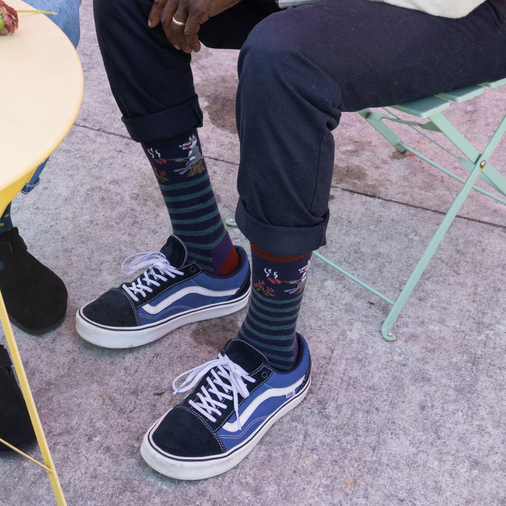 Close up of models feet sitting in chair wearing the 6096 Blackberry