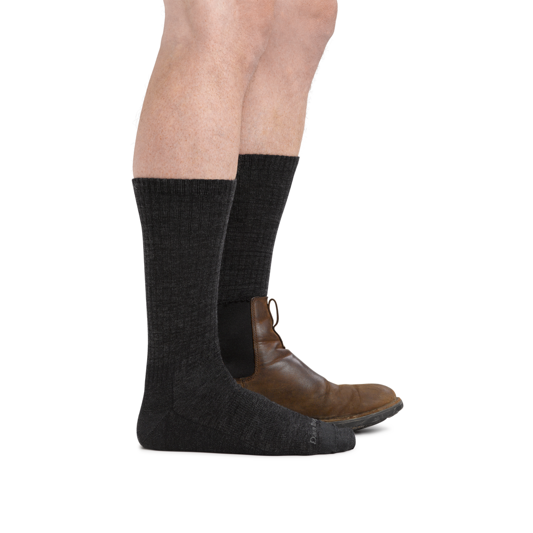 Man wearing The Standard Crew  Lightweight Lifestyle Sock in Charcoal wearing a boot on the back foot