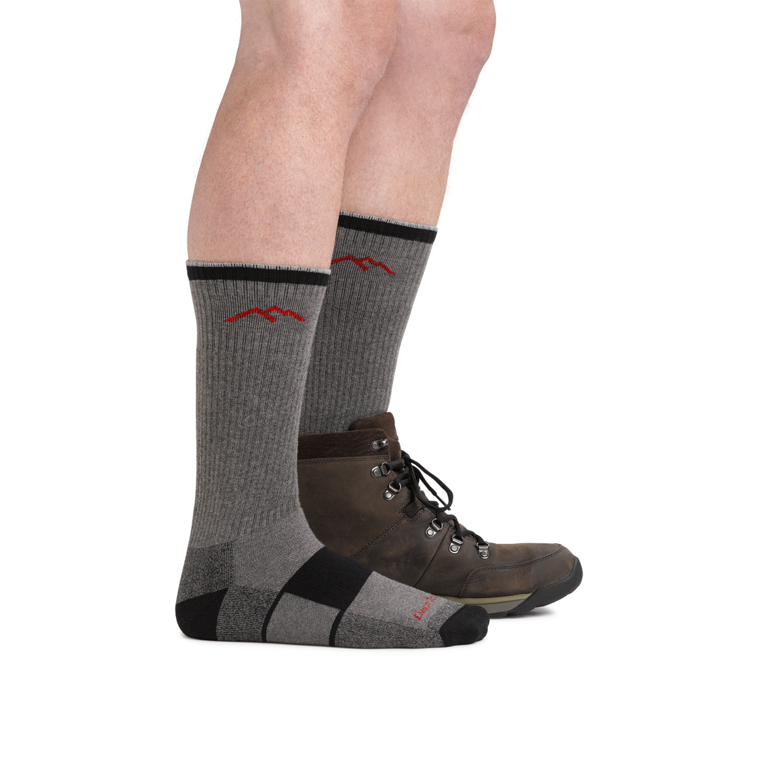 Man wearing Coolmax Hiker Boot Hiking sock in gray/black and back foot wearing the sock and a hiking boot