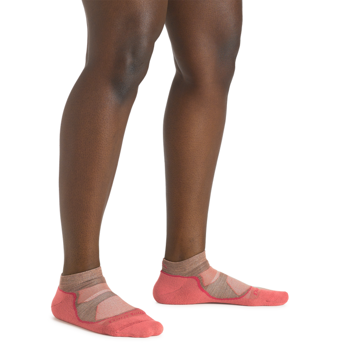 Close up shot of model wearing the women's light hiker no show hiking sock in canyon colorway with no shoes on