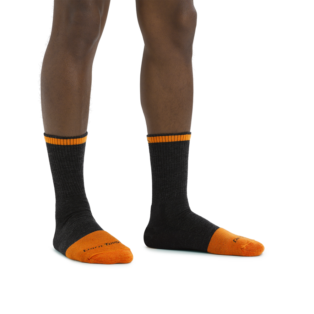 Man standing barefoot wearing Steely Micro Crew Midweight Work Sock in Graphite