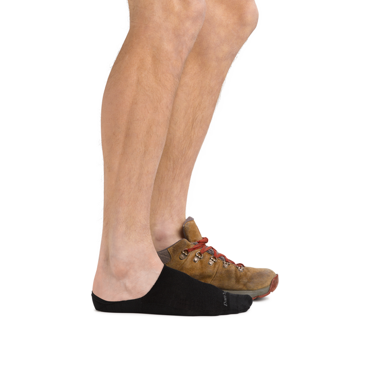 Man wearing Topless Solid No Show Hidden Lightweight Lifestyle Sock in Black with a casual shoe on the back foot