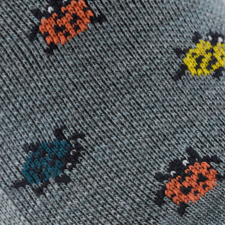 Call out detail image of the of the 6074 seafoam front image of crawling colorful lady bugs