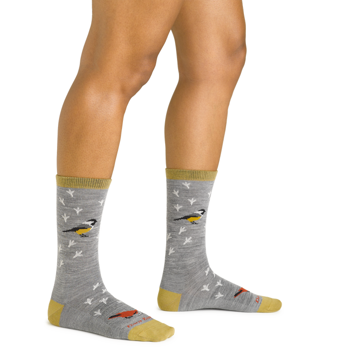 Close up studio shot of model wearing women's twitterpated crew lightweight lifestyle sock in gray