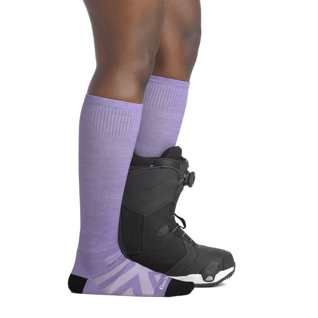 on model image side view with boot on back foot wearing the 8008 RFL over the calf sock in lavender colorway