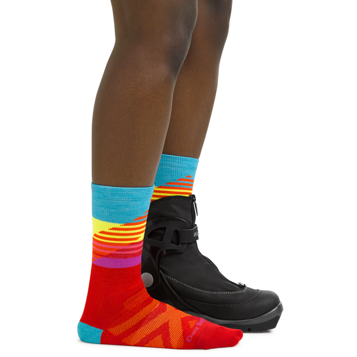 Women's Lillehammer Nordic Ski Socks in Red on foot with cross country ski boots