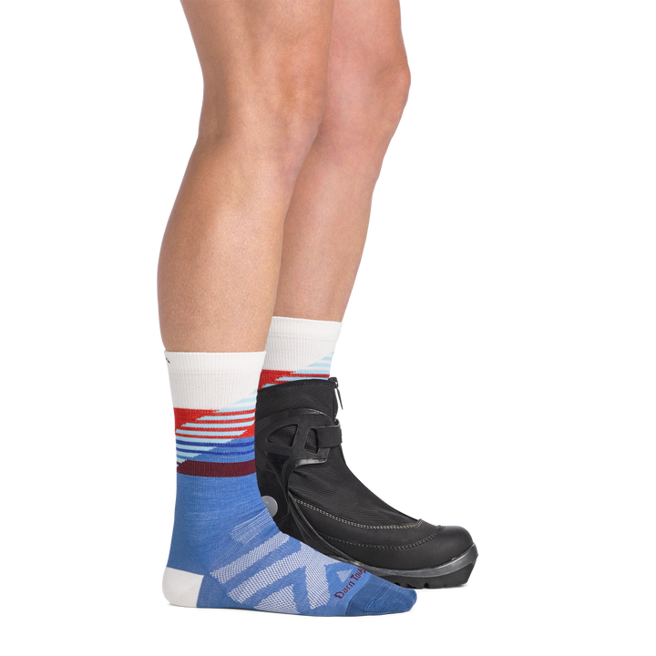 on model image side view back foot in boot wearing the 9031 lillihammer nordic boot sock in stellar colorway