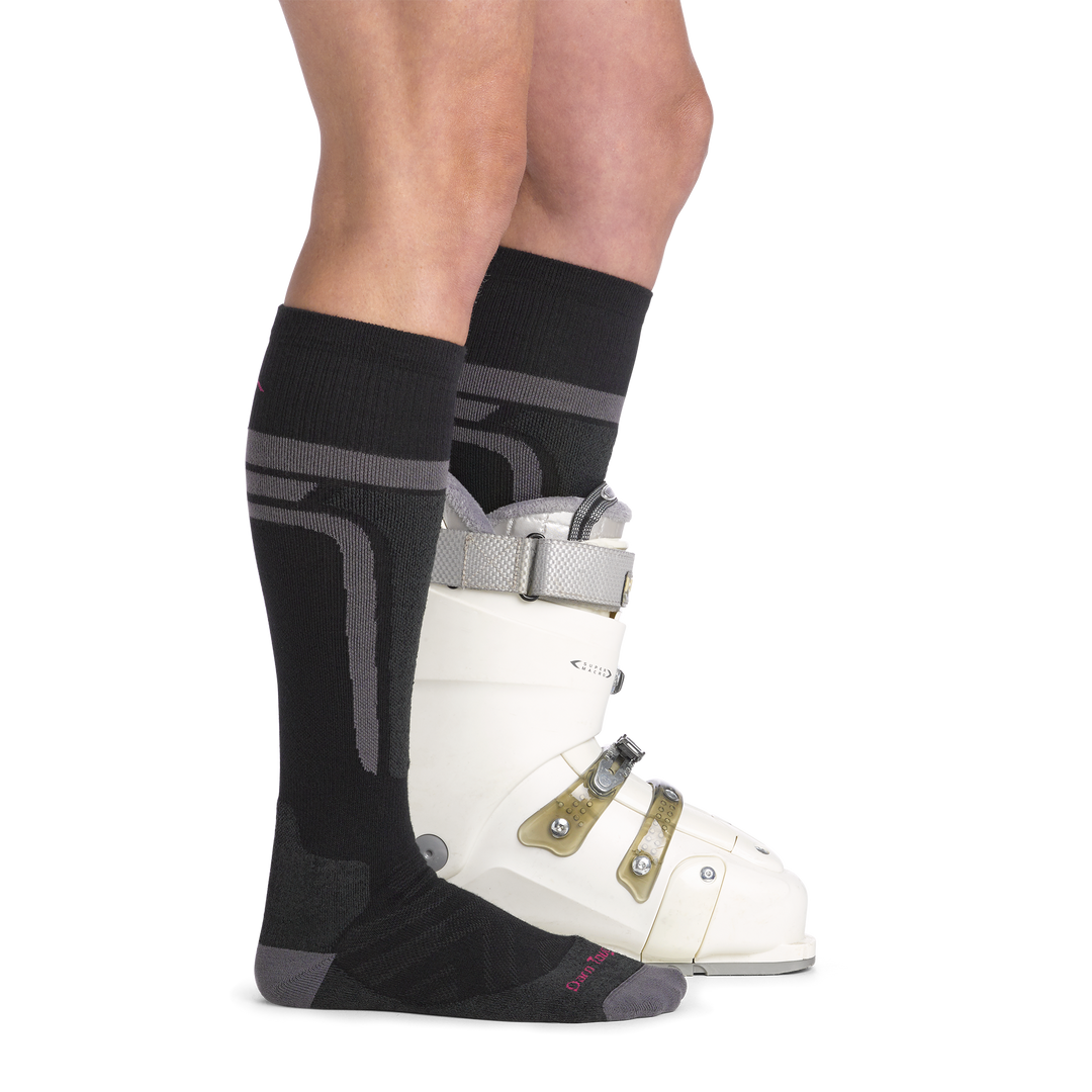 on model image side view back foot in boot wearing the 8059 thermolite edge over the calf sock in black colorway