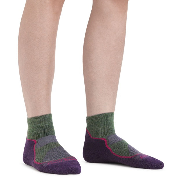 Woman wearing darn tough quarter crew hiking socks