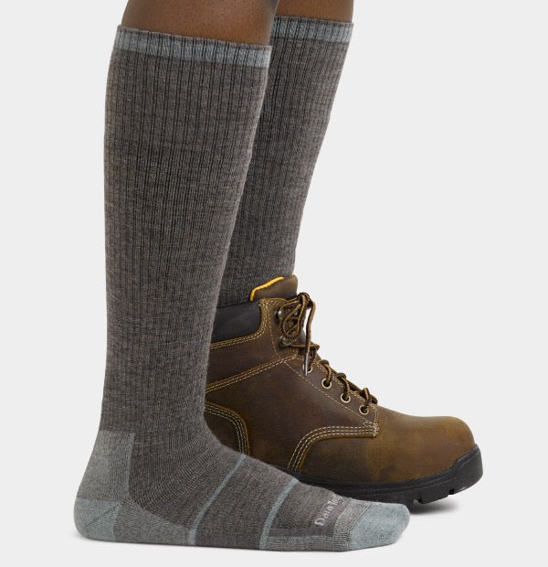 Woman wearing knee high work socks with work boots
