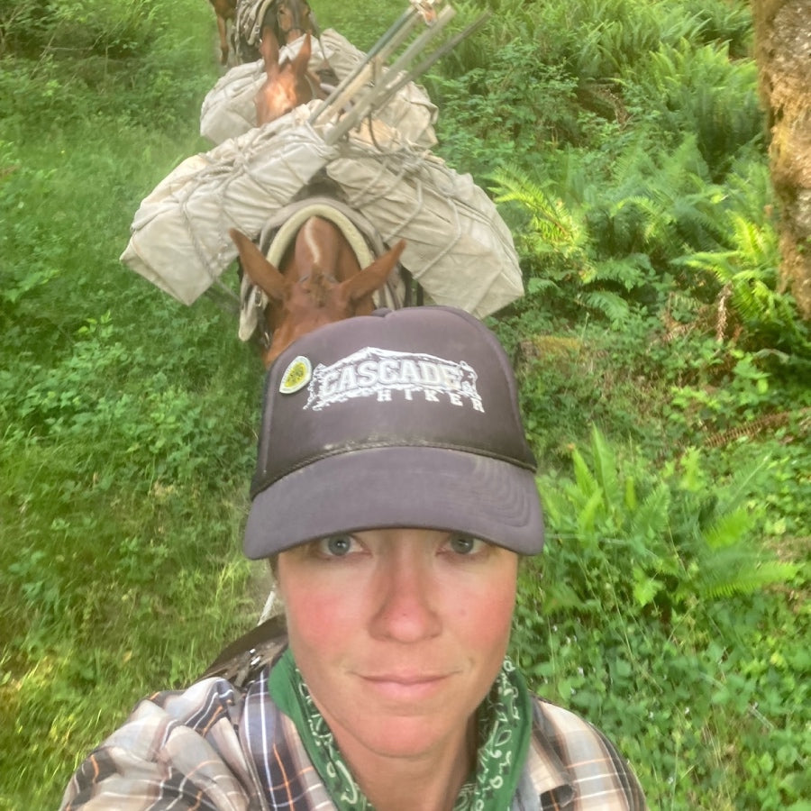 Heidi taking a selfie of herself with her mulestring