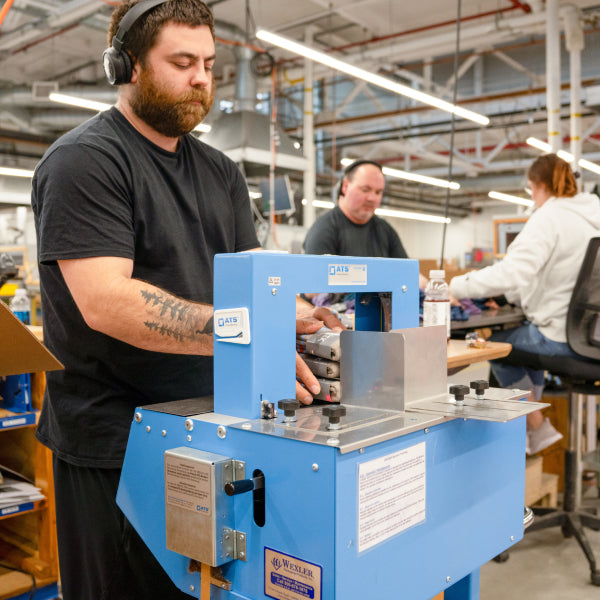 A Darn Tough employee in Vermont packaging socks.