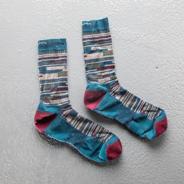 Striped dress socks covered by the darn tough warranty for indestructible socks