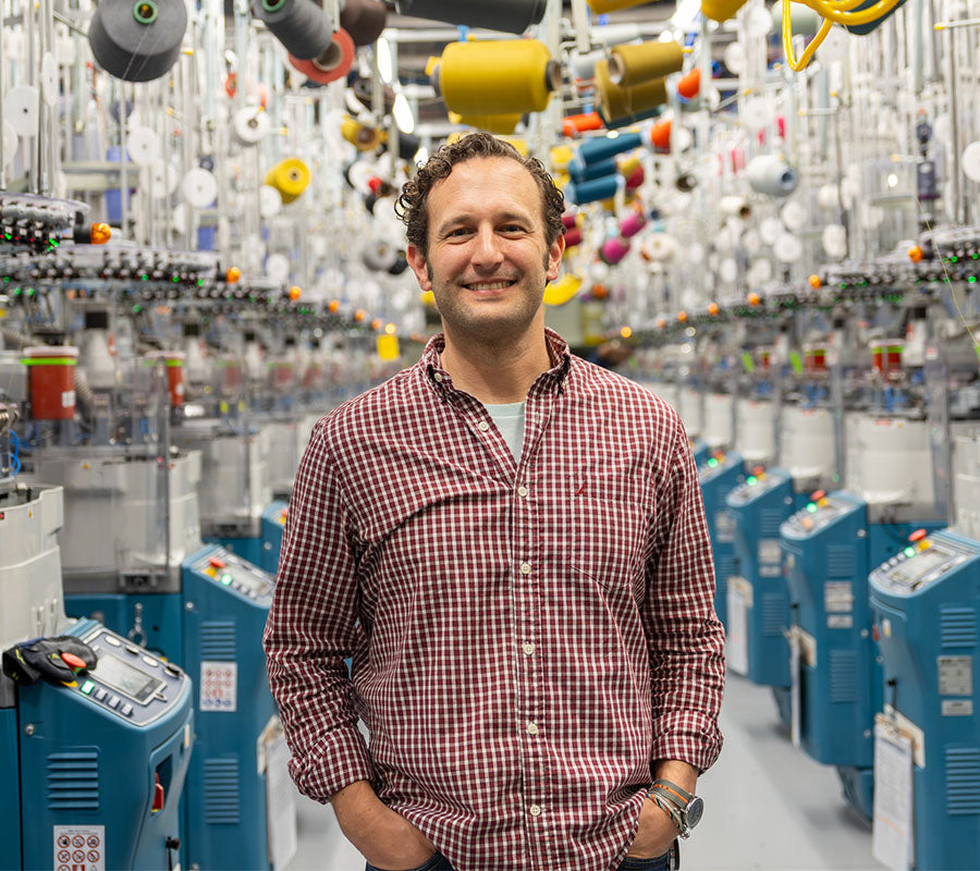 Joe standing on the Mill floor with a big smile on his face