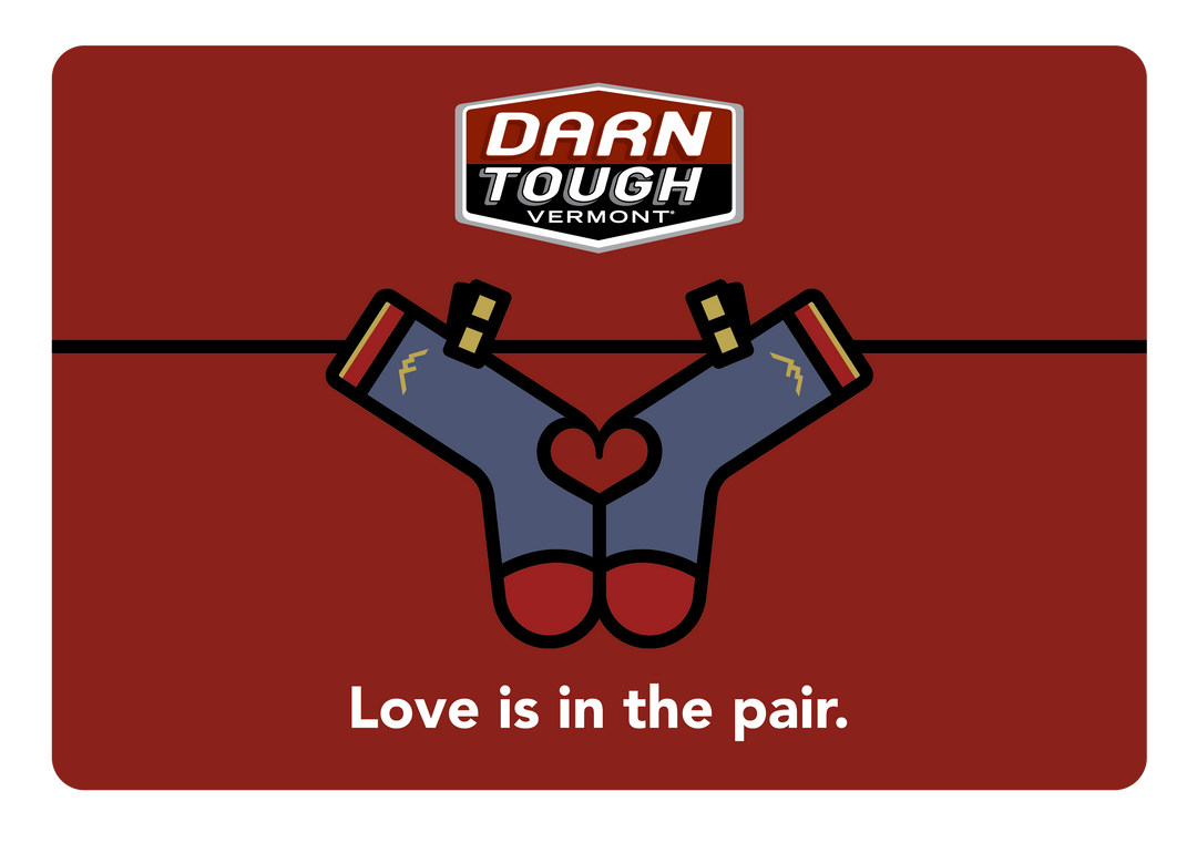 Love gift card with two socks hanging on a line with love in in the pair at the bottom