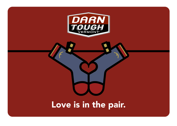 Love gift card with two socks hanging on a line with love in in the pair at the bottom