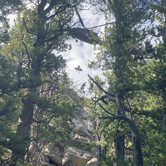 Michael getting air-lifted out by a helicopter