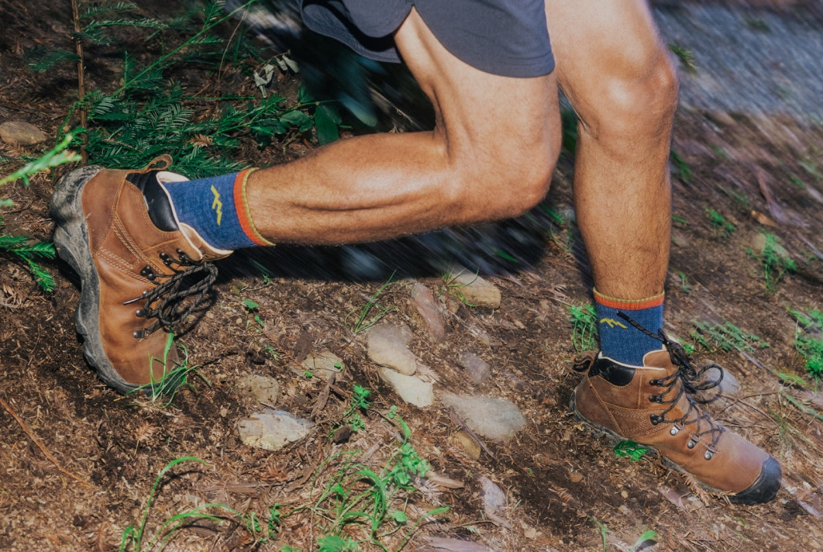 Shop hiking socks - a pair of feet hurrying down a trail