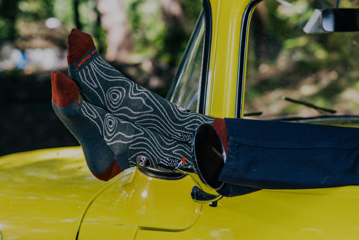 Shop Lifestyle socks - pair of feet sticking out a car window in cool socks