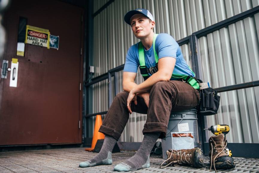 Woman in work zone wearing darn tough merino wool socks the most comfortable socks for work