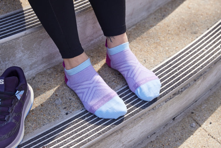 Shop ankle socks - feet wearing purple and blue ankle running socks