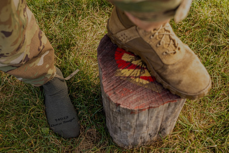 Shop Tactical Socks - feet wearing combat boots and berry compliant darn tough socks