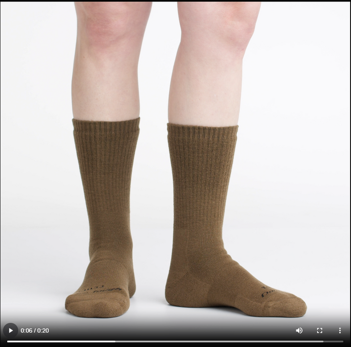 video of model wearing t4022 in coyote, rotating the feet to show the fit of the socks.