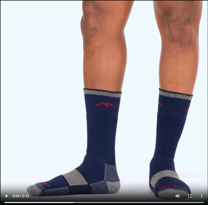 Model walking in the 1933 coolmax hiker boot in navy