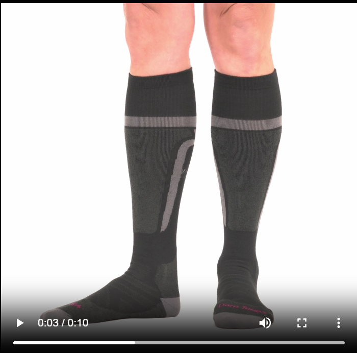 Model walking in the 8059 edge over the calf sock in black