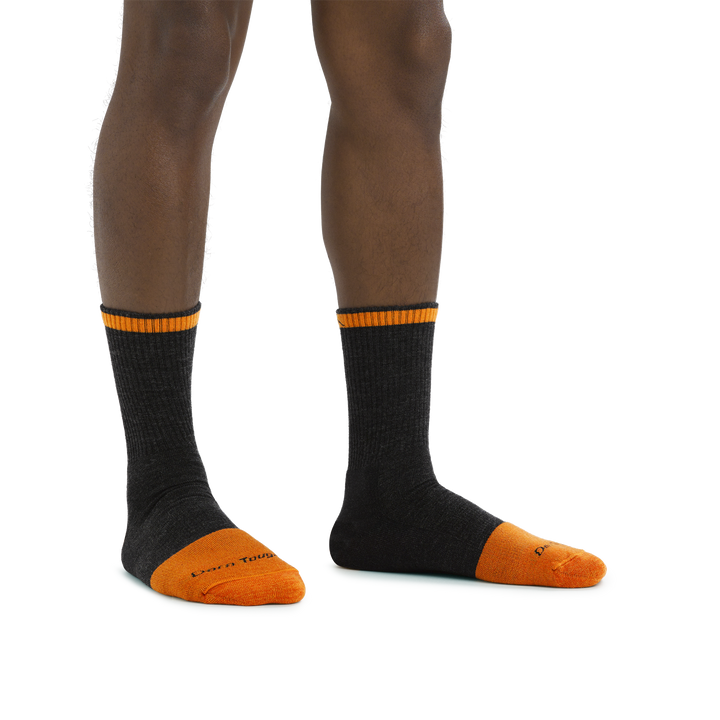 Man standing barefoot wearing Steely Micro Crew Midweight Work Sock in Graphite