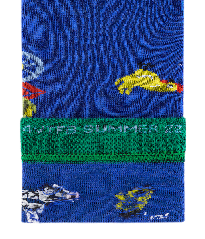 Close up of barnyard crew sock trim with 'For VT Food Bank Summer 22' stiched on the inside