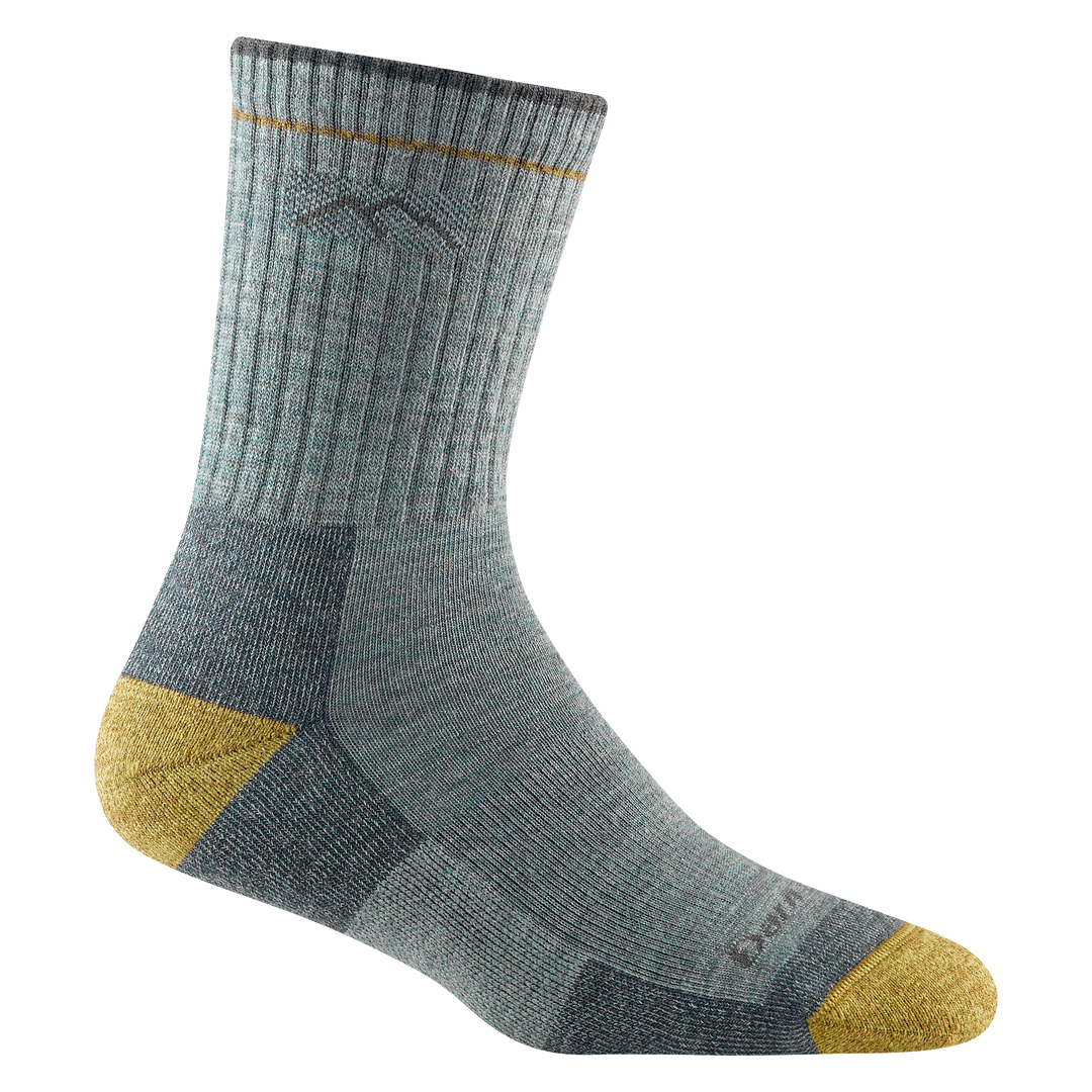 Studio shot of women's hiker micro crew sock in sage. It is sage green with golden-yellow accents.