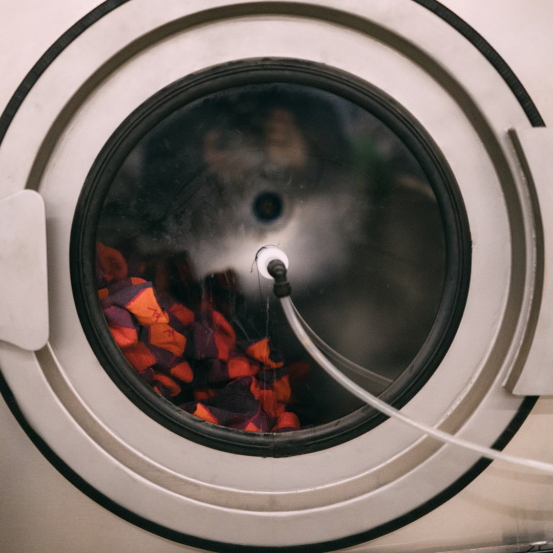 a washing machine full of merino wool socks
