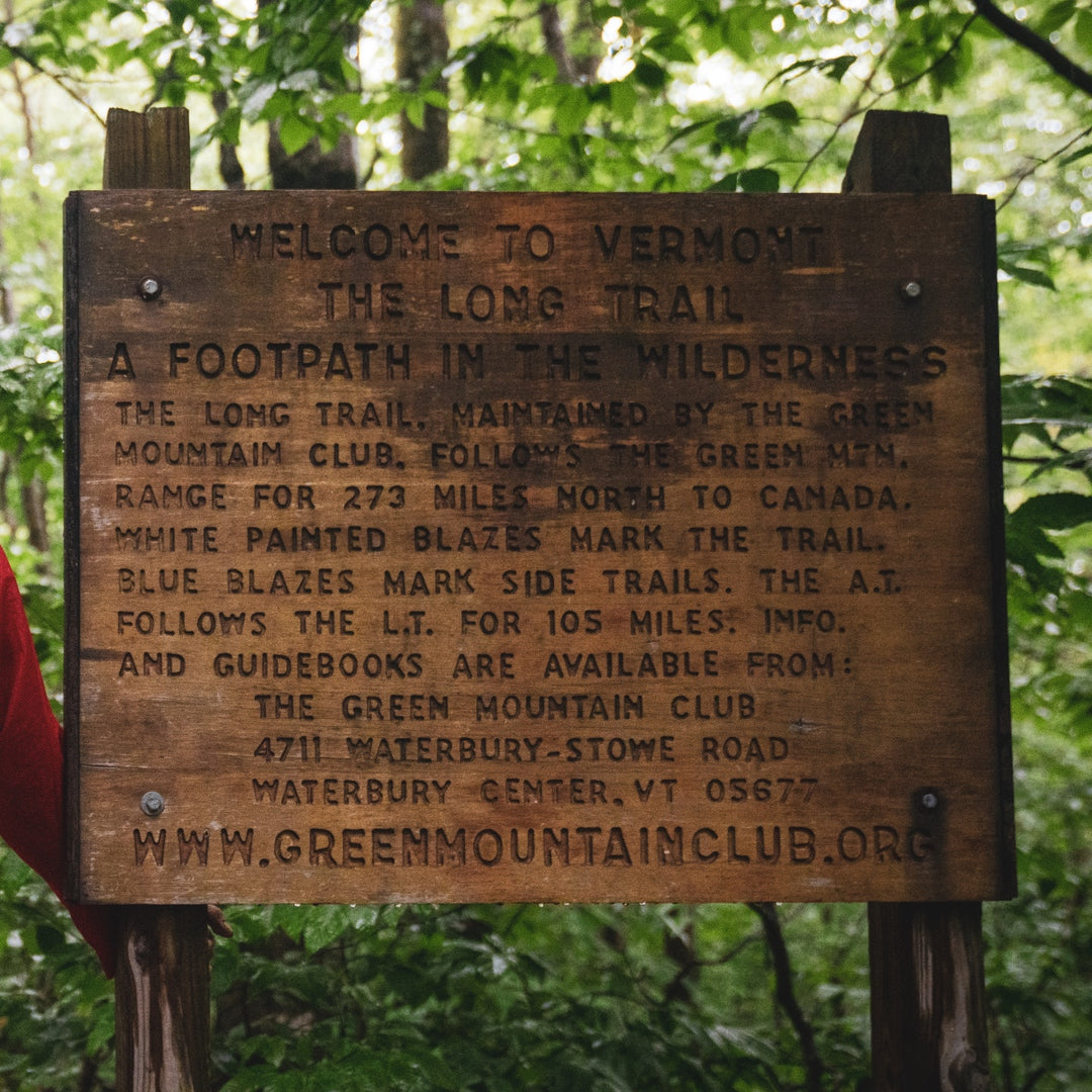 A wooden sign welcoming you to Vermont's Long Trail
