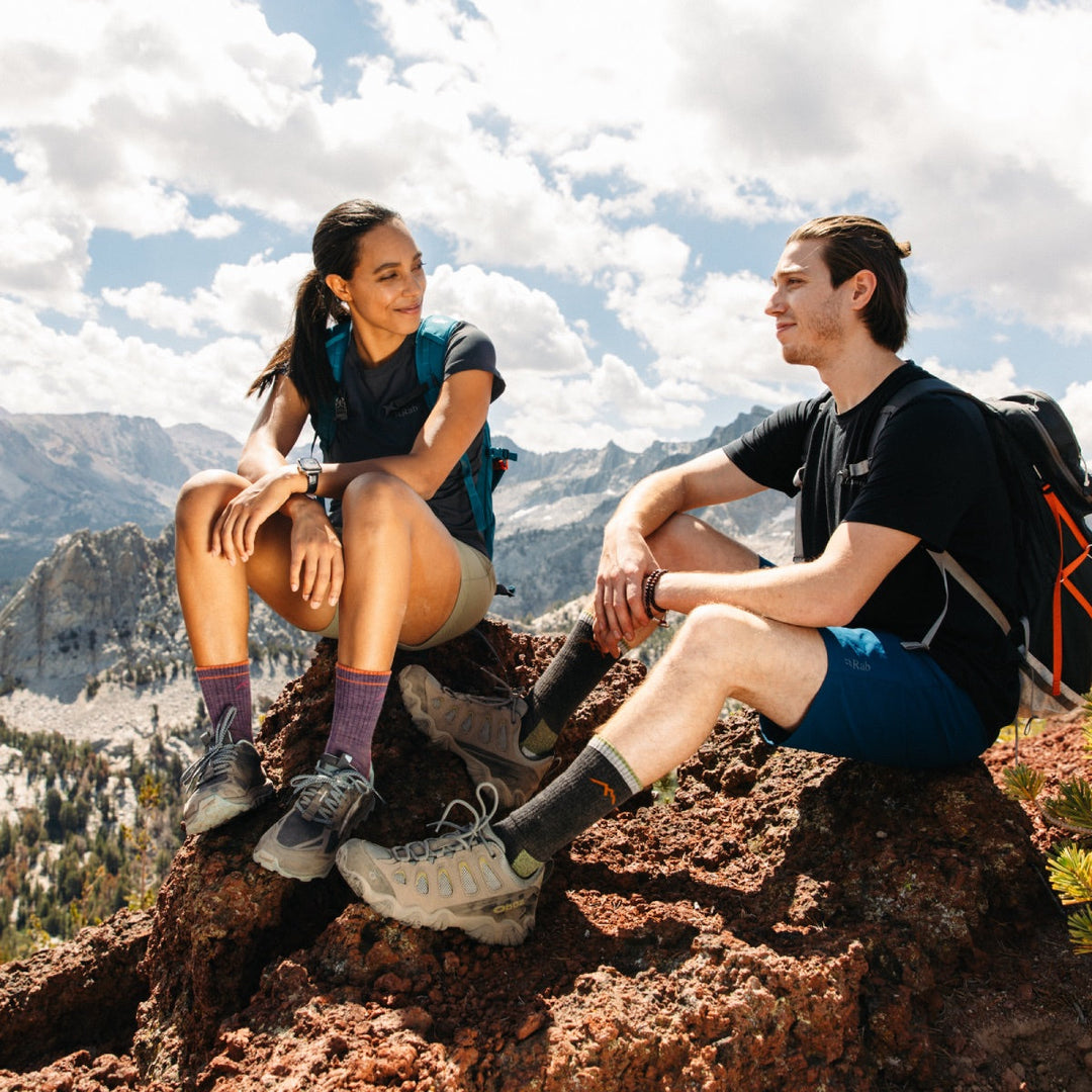 A couple on the summit wearing matching socks they bought each other for Valentine's Day