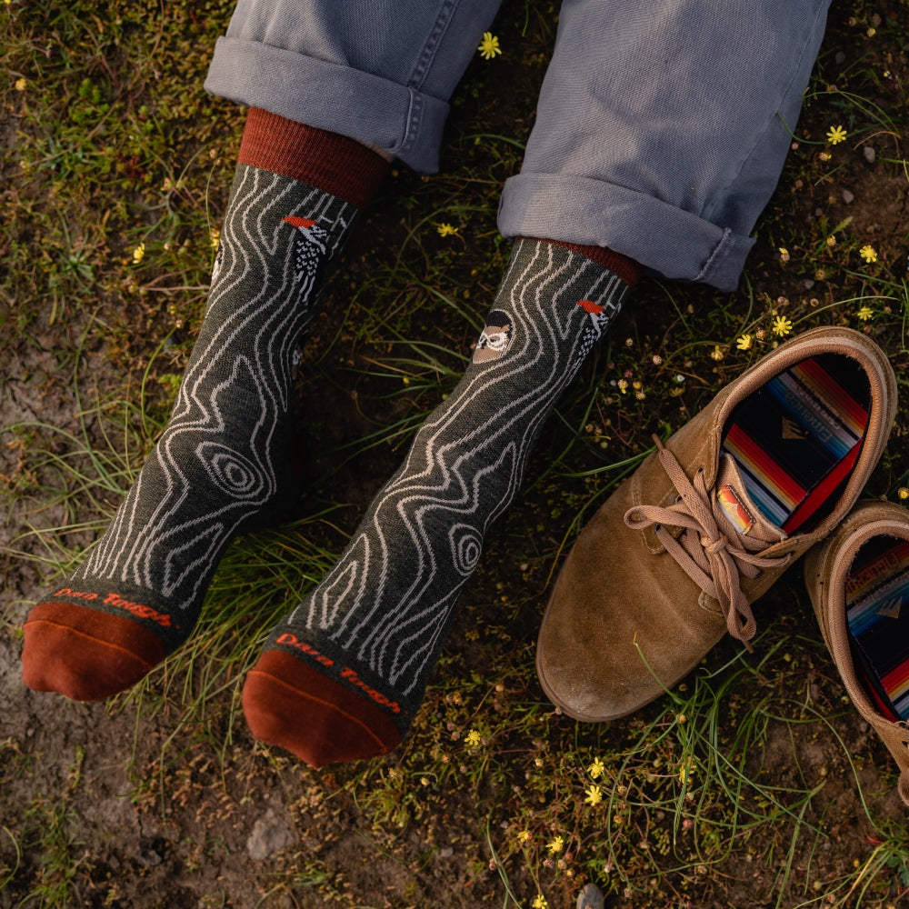 Feet wearing novelty dress socks, cuffed slacks, and suede shoes for men - the perfect fall outfit