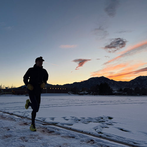 Andy out on the trail as the sun sets, running in winter