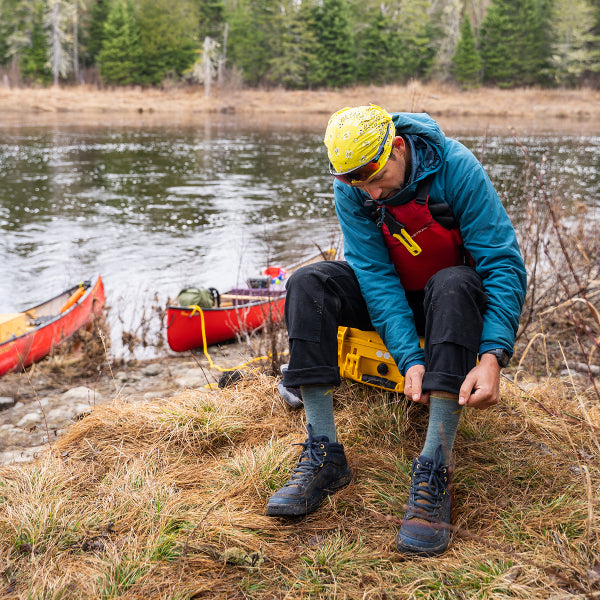 A cancer adjusting his merino wool socks before heading out