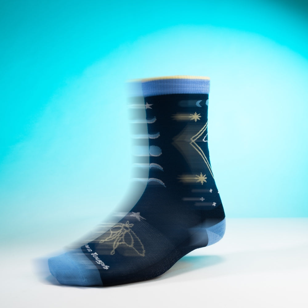 The Luna sock from Darn Tough, a dark blue sock with a luna moth and moon pattern