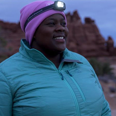 Mirna Valerio out running at night with a headlamp on
